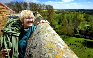 Canon Sue Booys abseils the tower